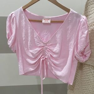 Adorable pink crop top.